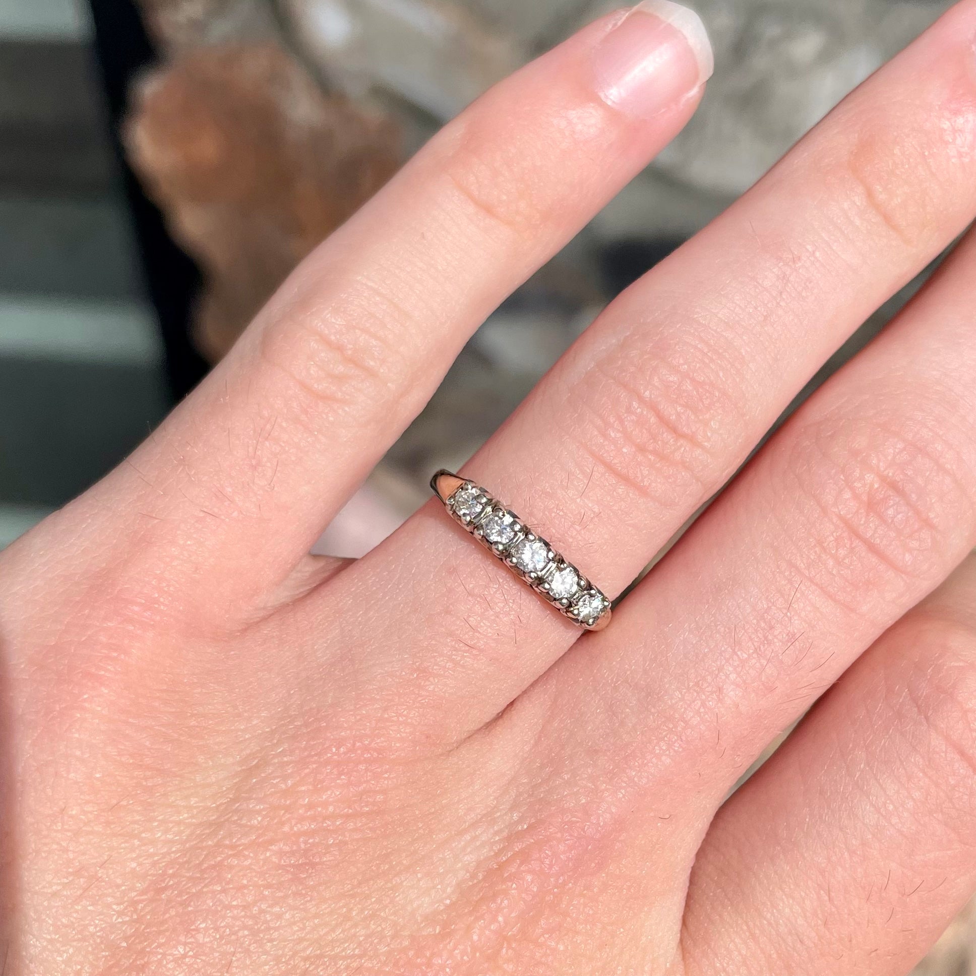 A vintage ladies' five-stone round cut diamond yellow gold wedding band