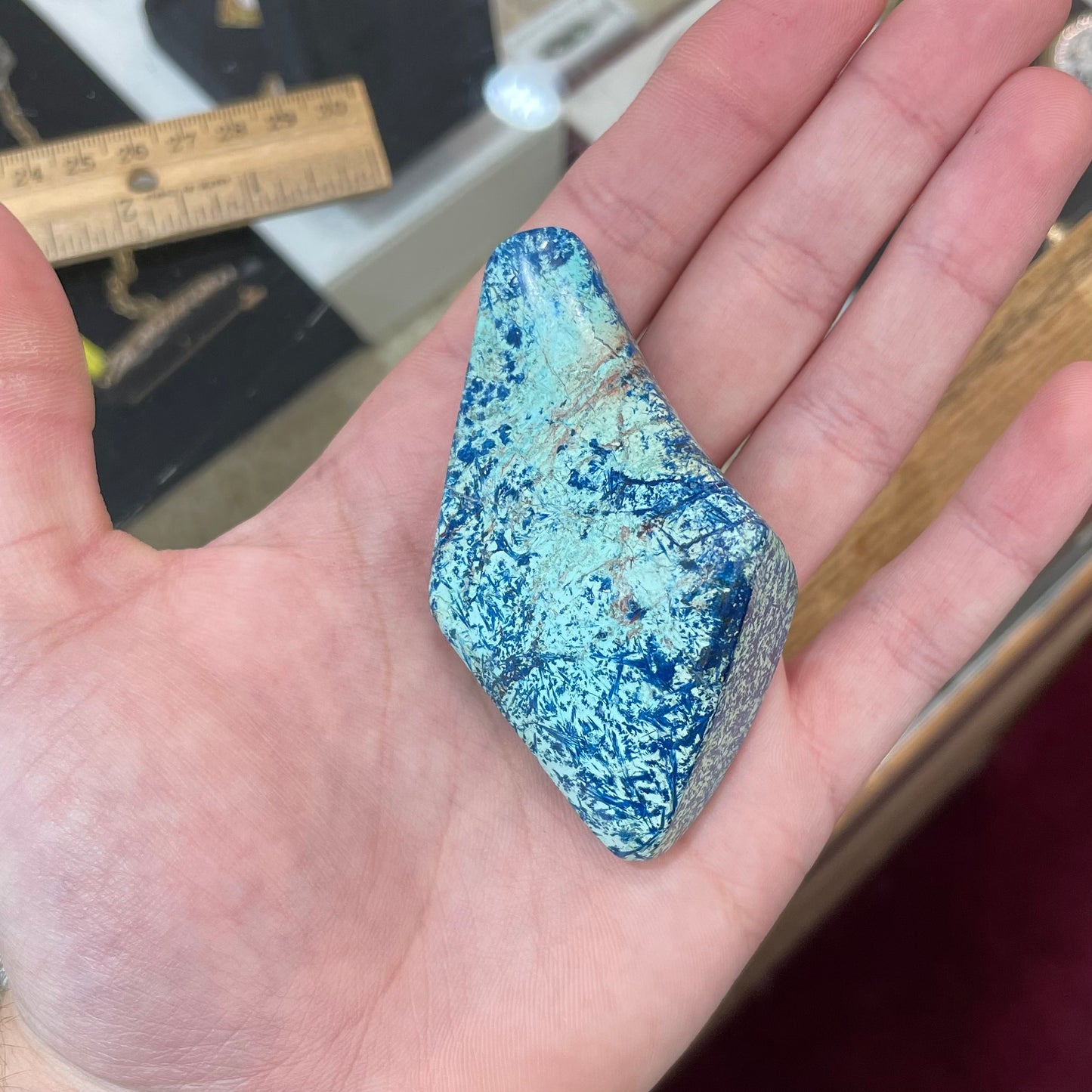 A freeform shape, polished azurite in turquoise stone.