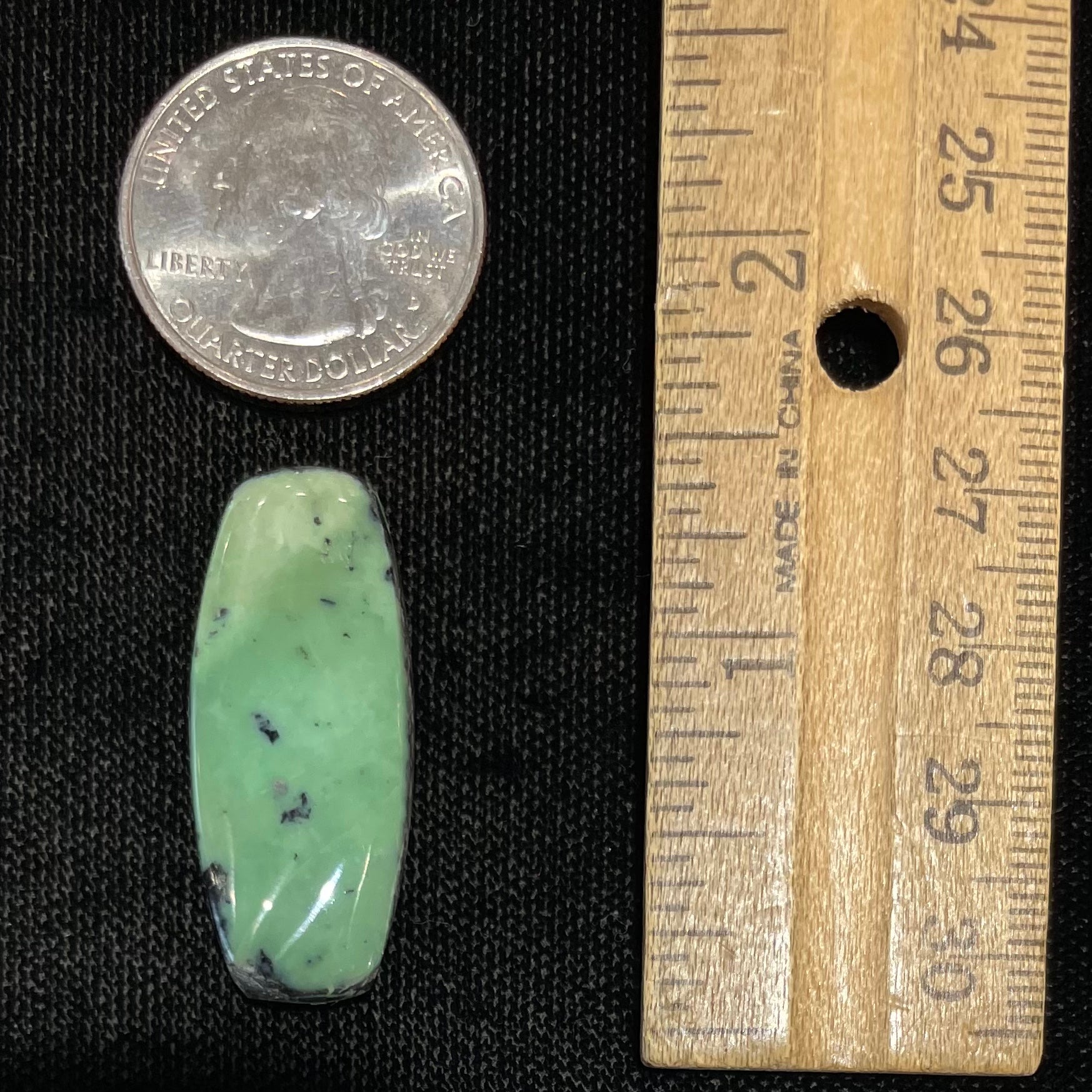 A loose, green turquoise stone cabochon from Royston Mining District, Arizona.