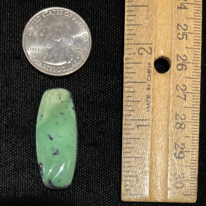 A loose, green turquoise stone cabochon from Royston Mining District, Arizona.
