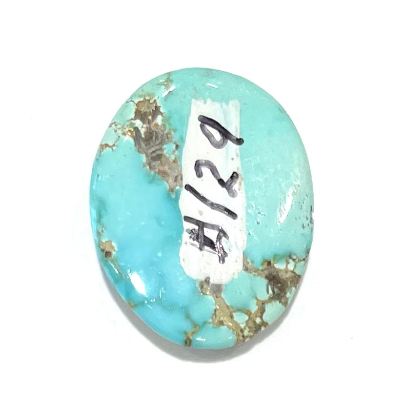 A loose, oval cabochon cut blue turquoise stone from Sonora, Mexico.