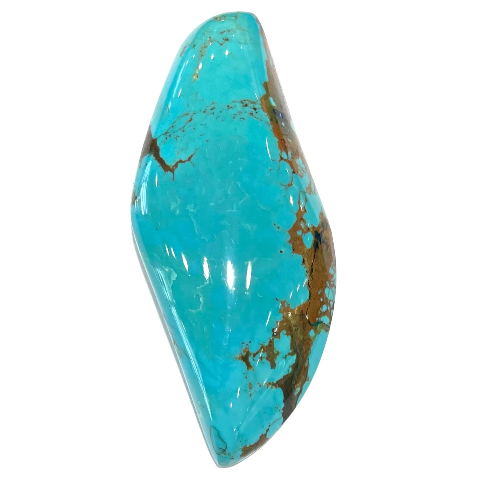 A freeform cabochon cut Bisbee turquoise stone.  The stone has been dyed to improve color.