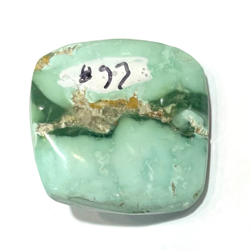 A loose, cushion cabochon cut variscite stone from Utah, USA.