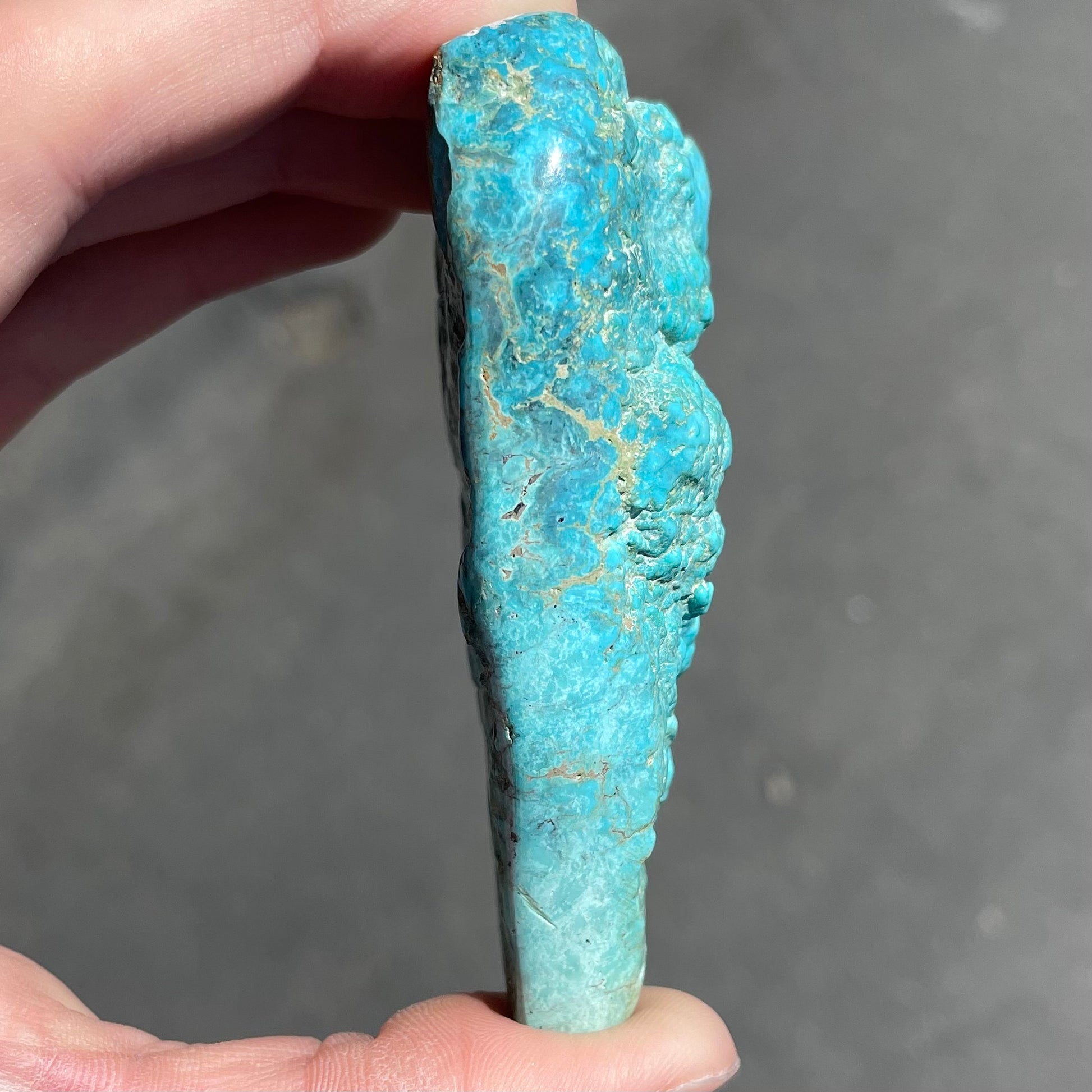 A loose, lightly polished turquoise nugget from Sleeping Beauty Mine, Arizona.