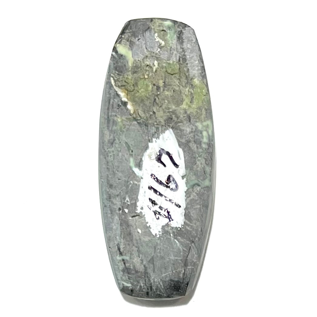 A loose, green turquoise stone cabochon from Royston Mining District, Arizona.