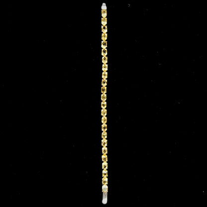 A sterling silver ladies' tennis bracelet set with faceted oval cut citrine stones.