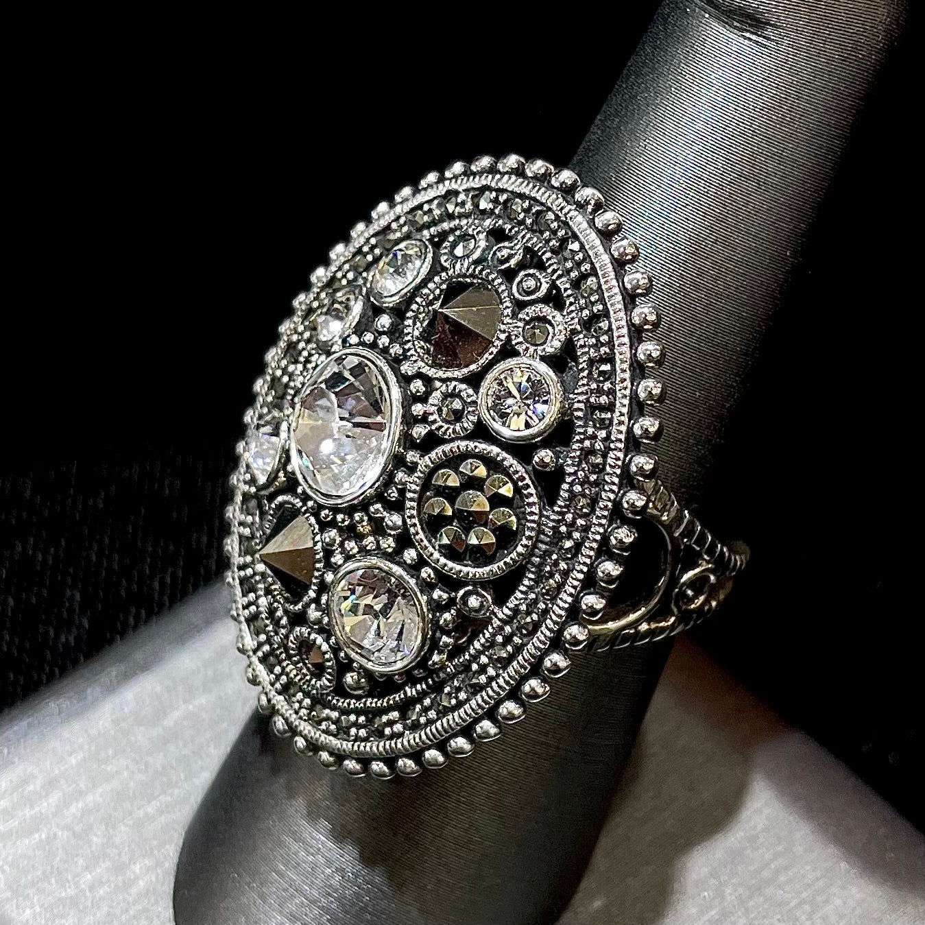 Silver Steam Punk style gear ring set with marcasite and round faceted glass stones.
