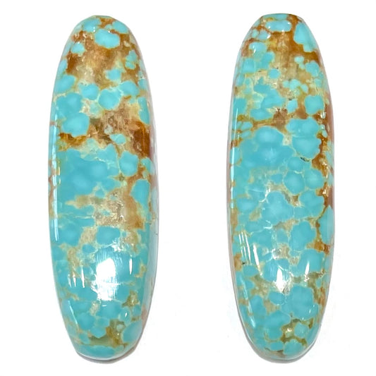 A pair of loose oval cabochon cut turquoise stones from Number 8 Mine, Nevada.