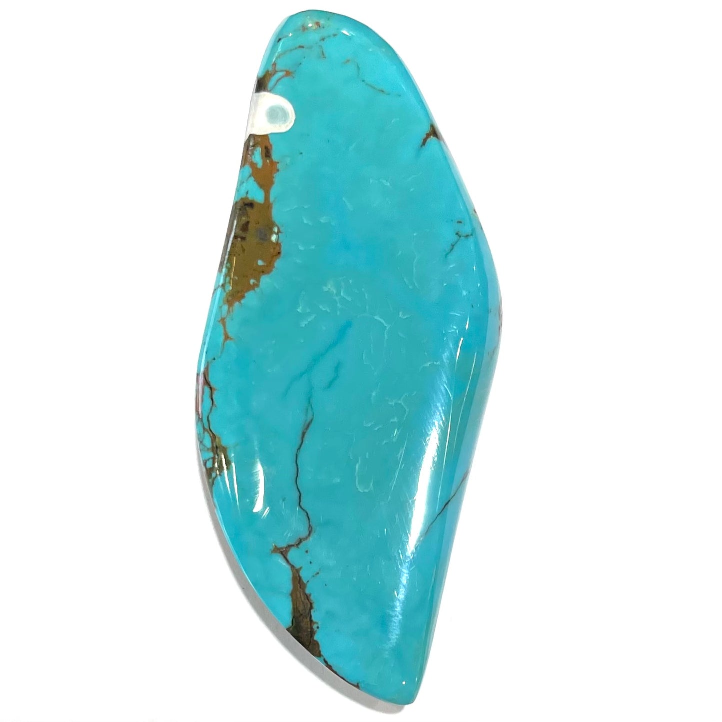 A freeform cabochon cut Bisbee turquoise stone.  The stone has been dyed to improve color.