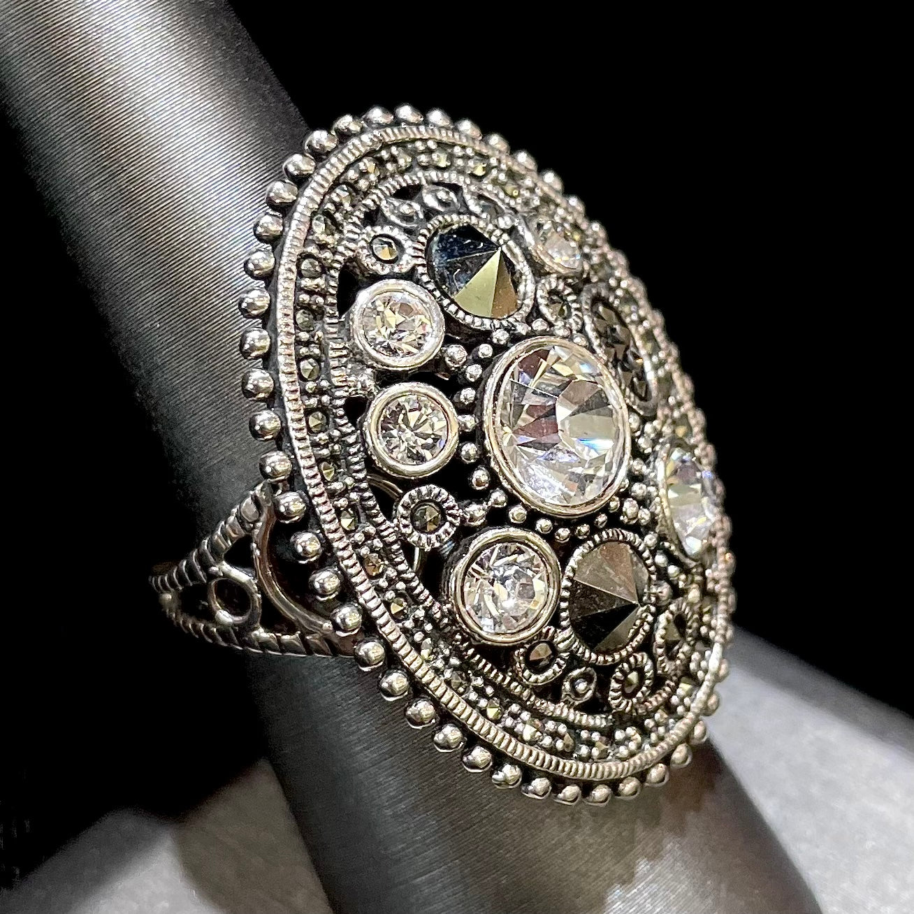 Silver Steam Punk style gear ring set with marcasite and round faceted glass stones.