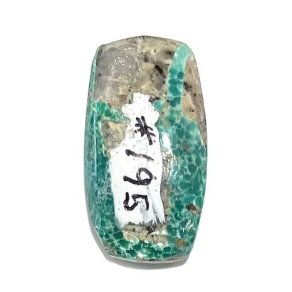 A loose, green cabochon cut turquoise stone from Royston District, Nevada.
