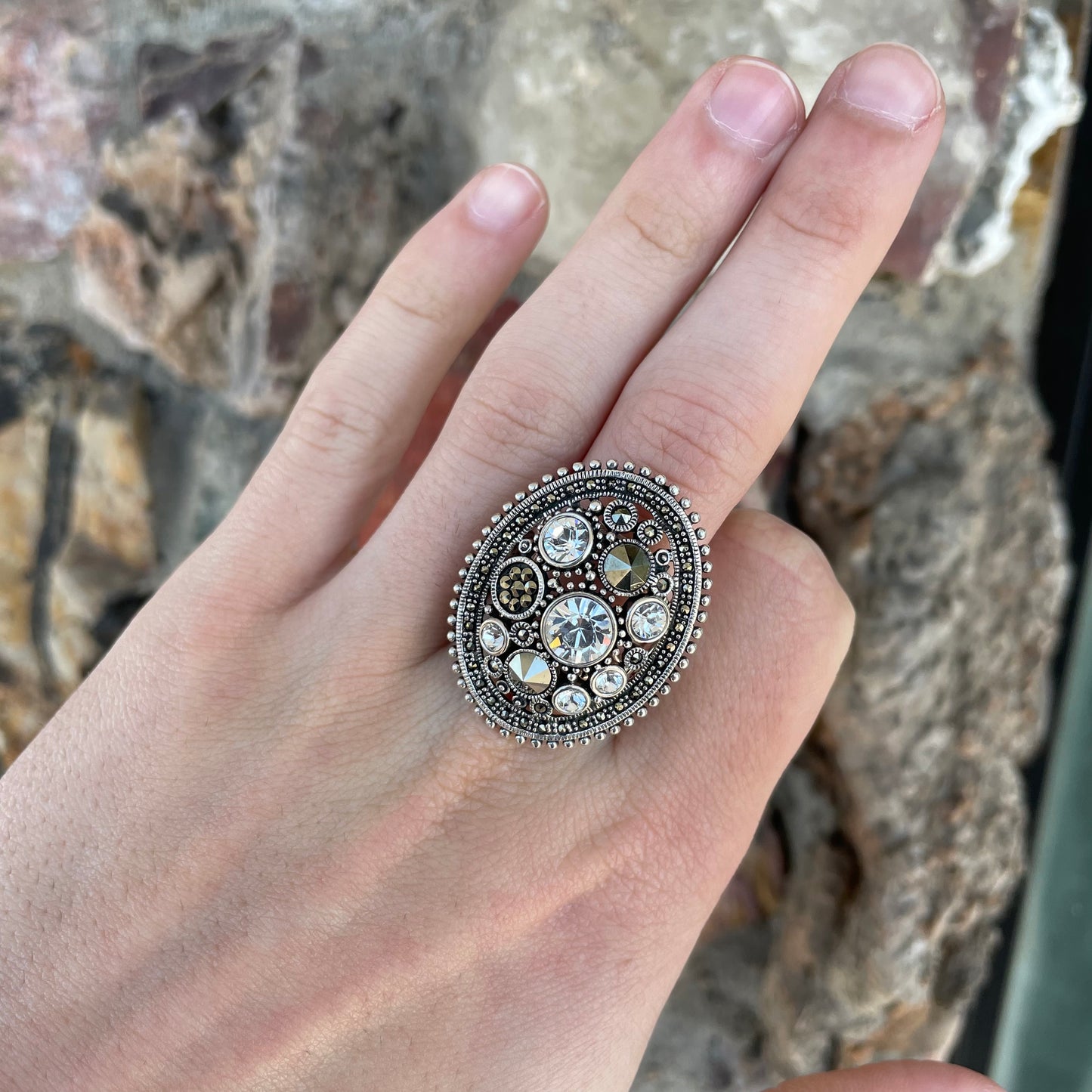 Silver Steam Punk style gear ring set with marcasite and round faceted glass stones.