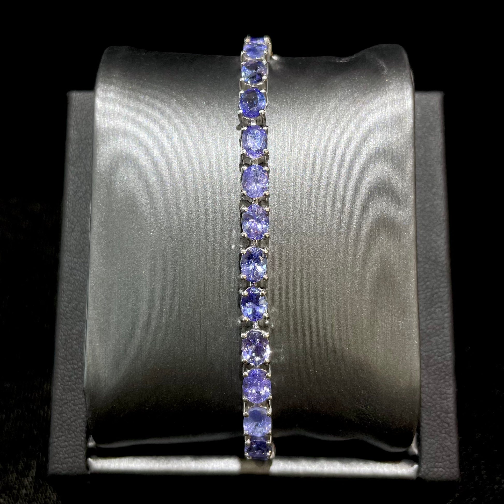 Violet tanzanite tennis bracelet in sterling silver.