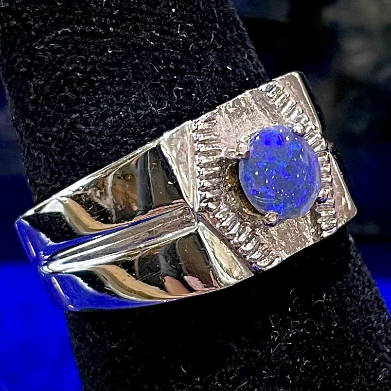 A round black crystal opal solitaire sterling silver men's ring.