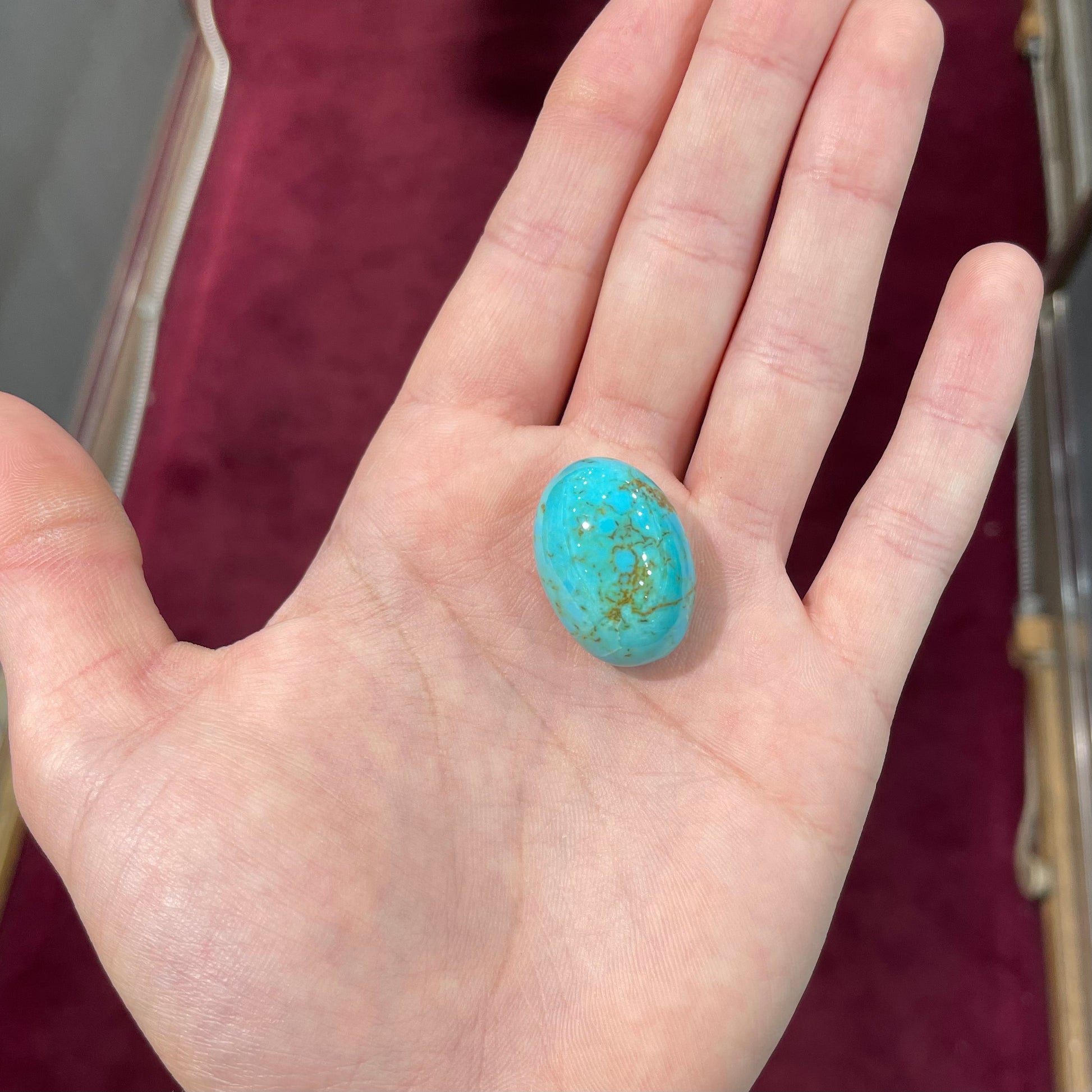 A loose Pilot Mountain turquoise stone cabochon.