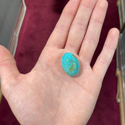 A loose Pilot Mountain turquoise stone cabochon.