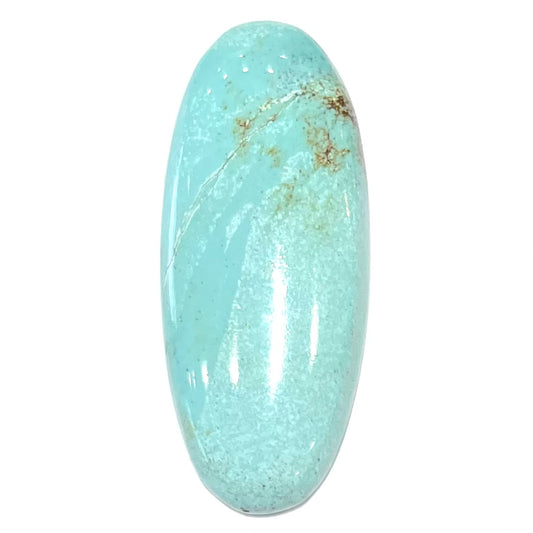 A loose, light blue, oval cabochon cut turquoise stone from Sleeping Beauty Mine, Arizona.