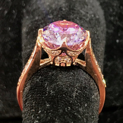 Purple CZ ring with white CZ side stones. Rose gold plated over sterling silver.