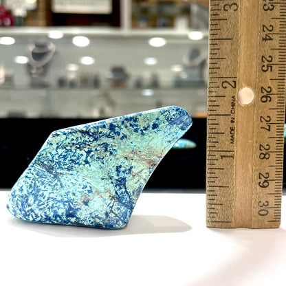 A freeform shape, polished azurite in turquoise stone.