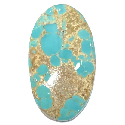 An oval cabochon cut loose Fox turquoise stone.