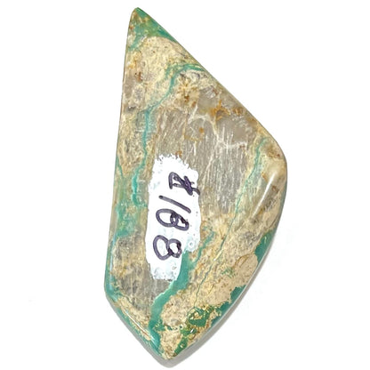 A loose, freeform cabochon cut green turquoise stone from Royston Mining District, Nevada.