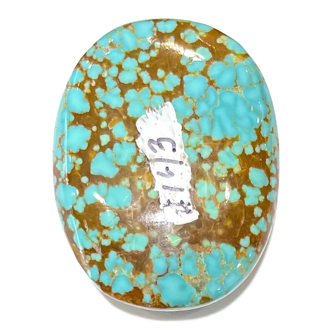 A loose, oval cut turquoise cabochon from Number 8 Mine, Nevada.  The stone is blue with a golden brown webbed matrix.