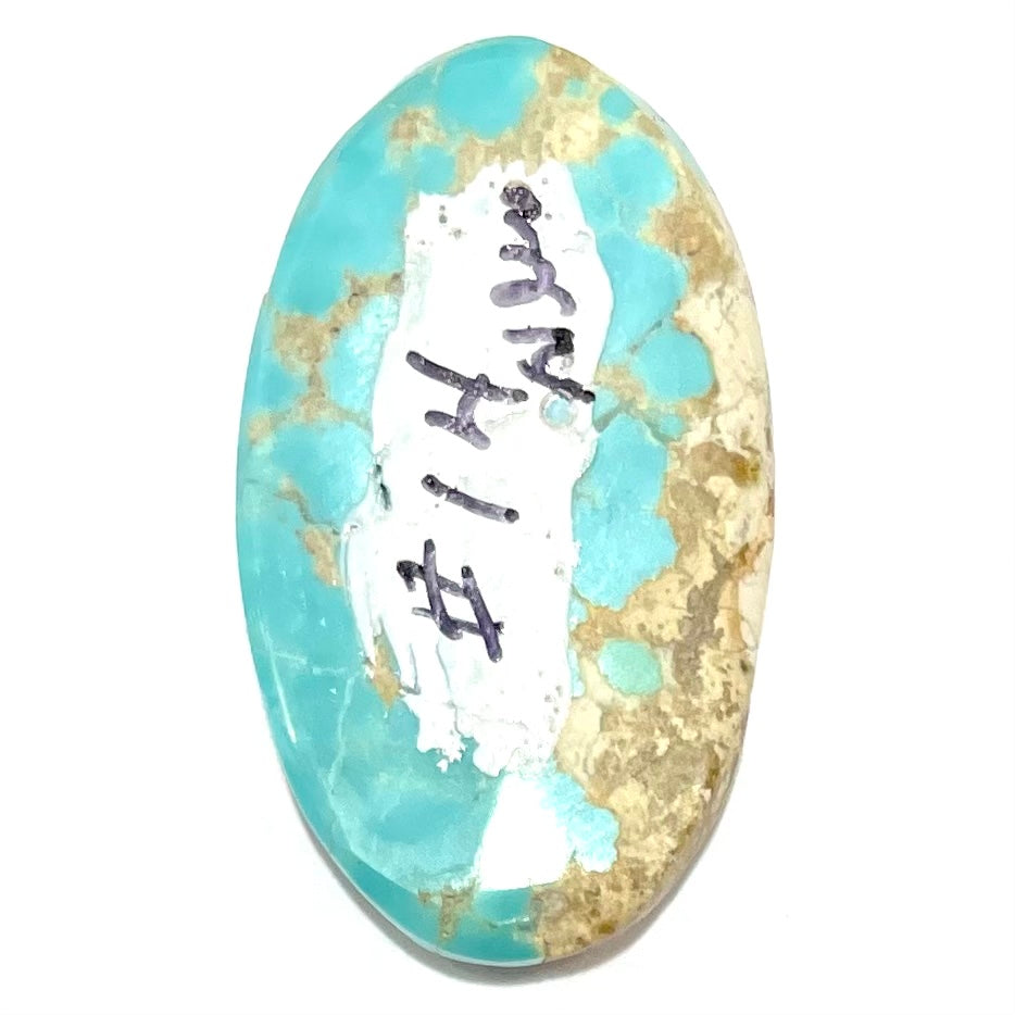 An oval cabochon cut loose Fox turquoise stone.