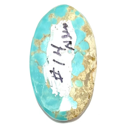 An oval cabochon cut loose Fox turquoise stone.