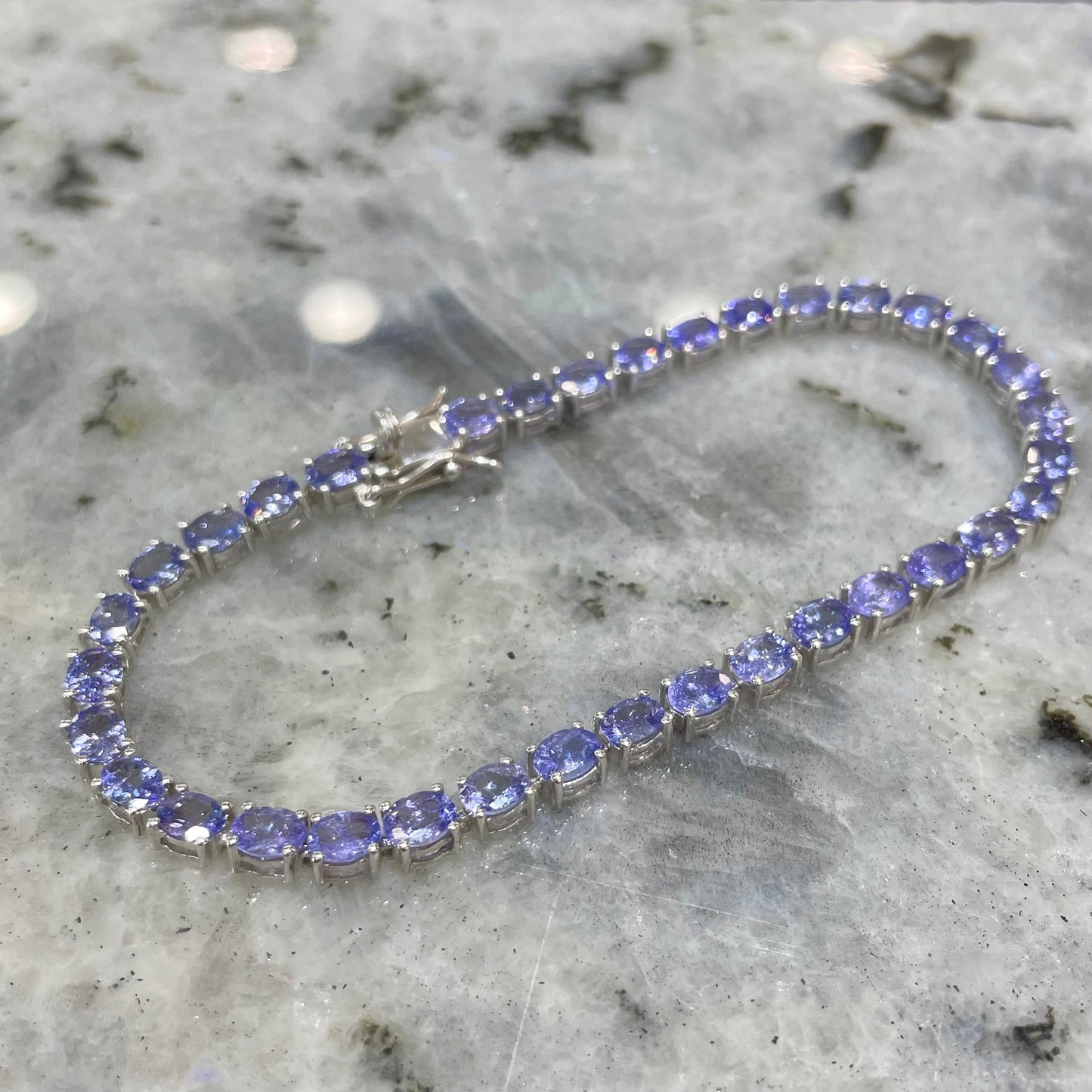 Sterling silver tanzanite tennis bracelet.