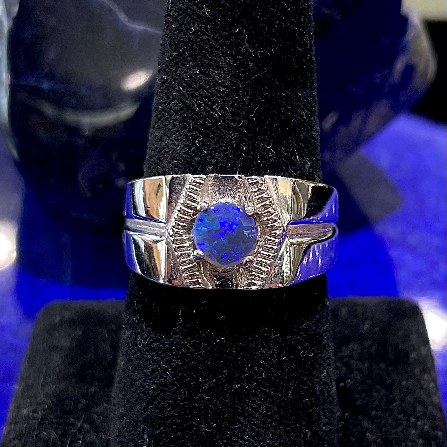 A round black crystal opal solitaire sterling silver men's ring.