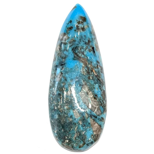 A loose, teardrop shaped, cabochon cut turquoise stone from Kingman, Arizona.  Pyrite inclusions can be seen.