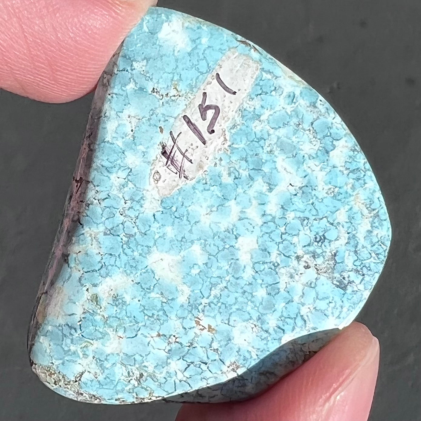 Loose light blue turquoise stone with gray matrix from Baja California, Mexico.