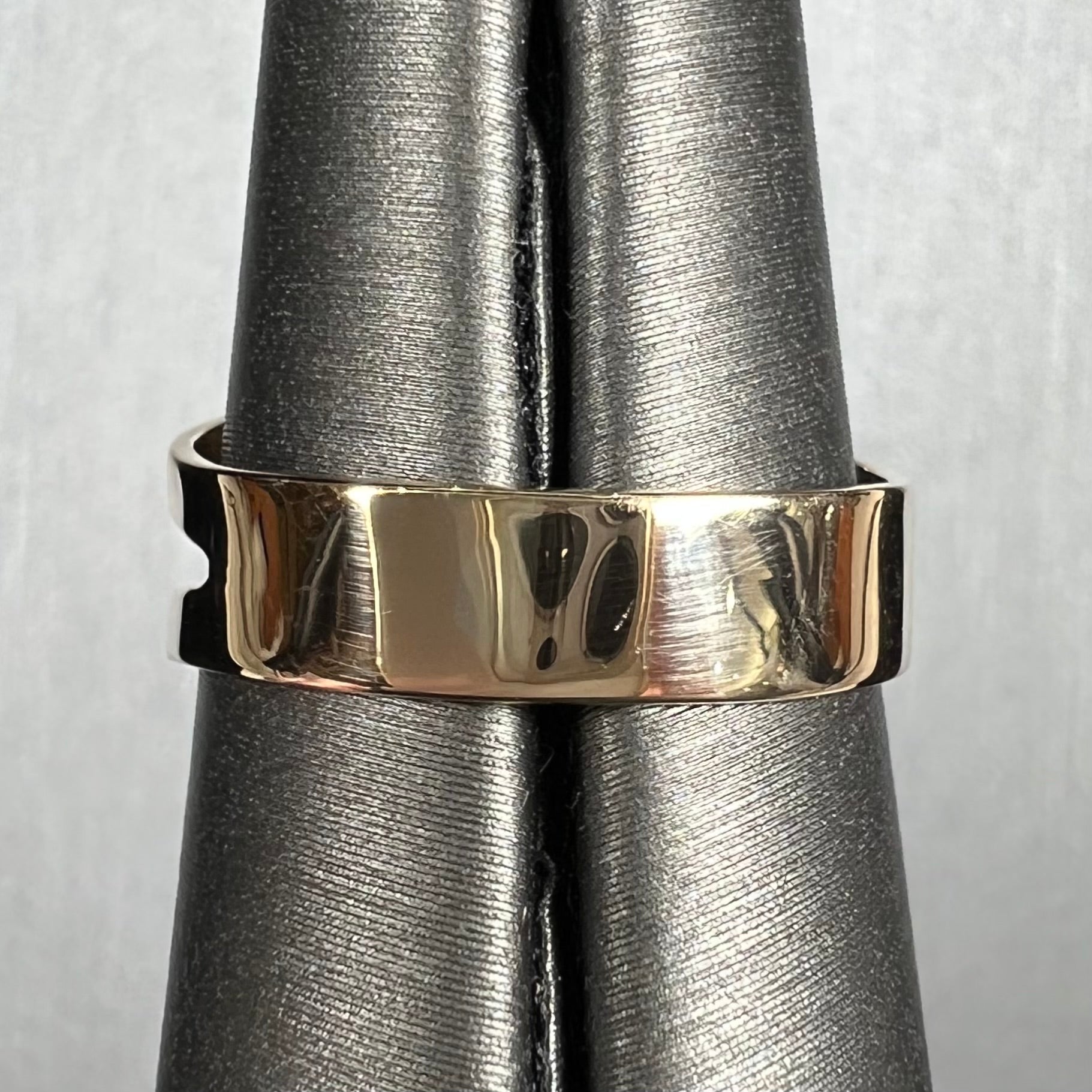 A handmade split shank ring set with Sleeping Beauty turquoise in yellow gold.