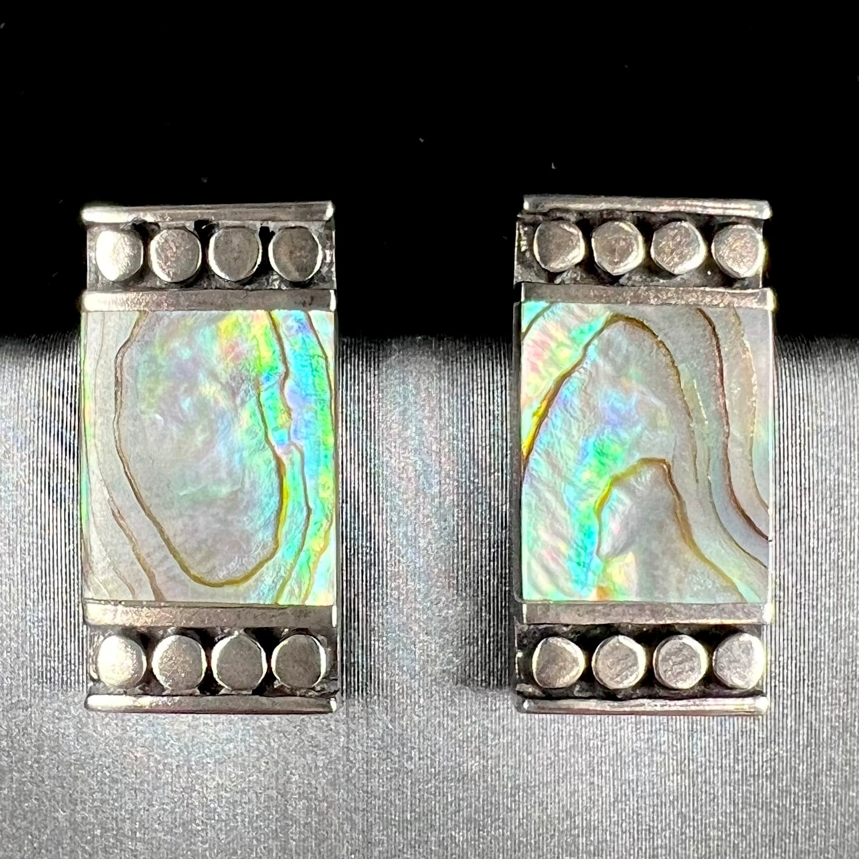 A pair of mother of pearl shell earrings set in sterling silver.