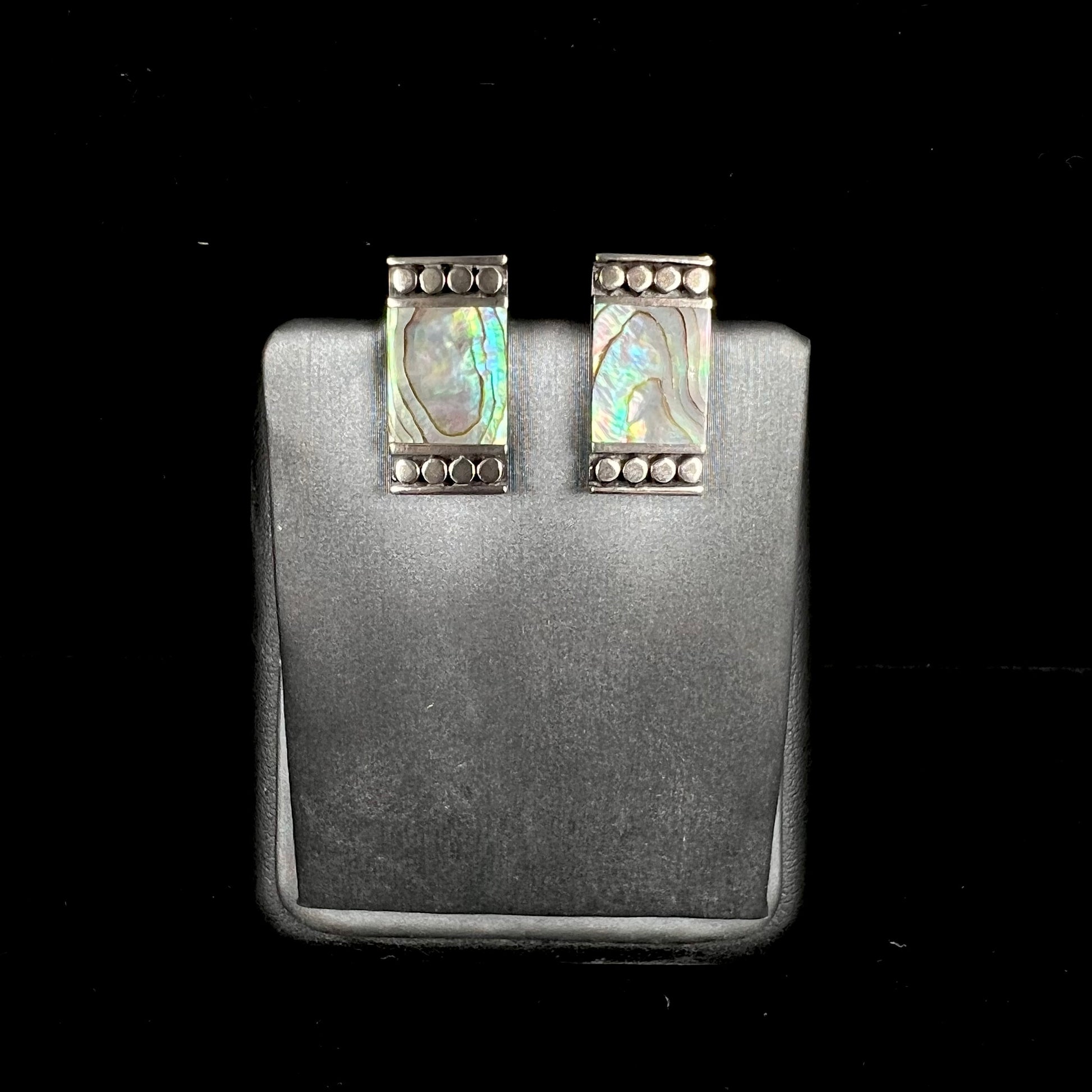 A pair of mother of pearl shell earrings set in sterling silver.