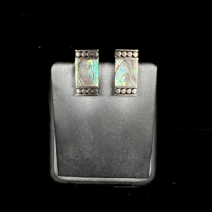 A pair of mother of pearl shell earrings set in sterling silver.