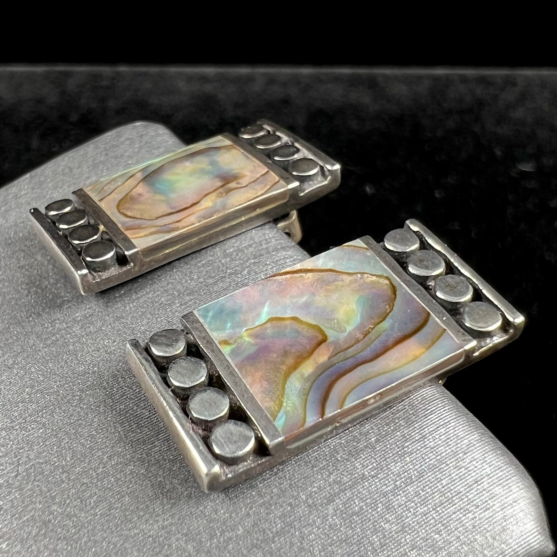 A pair of mother of pearl shell earrings set in sterling silver.