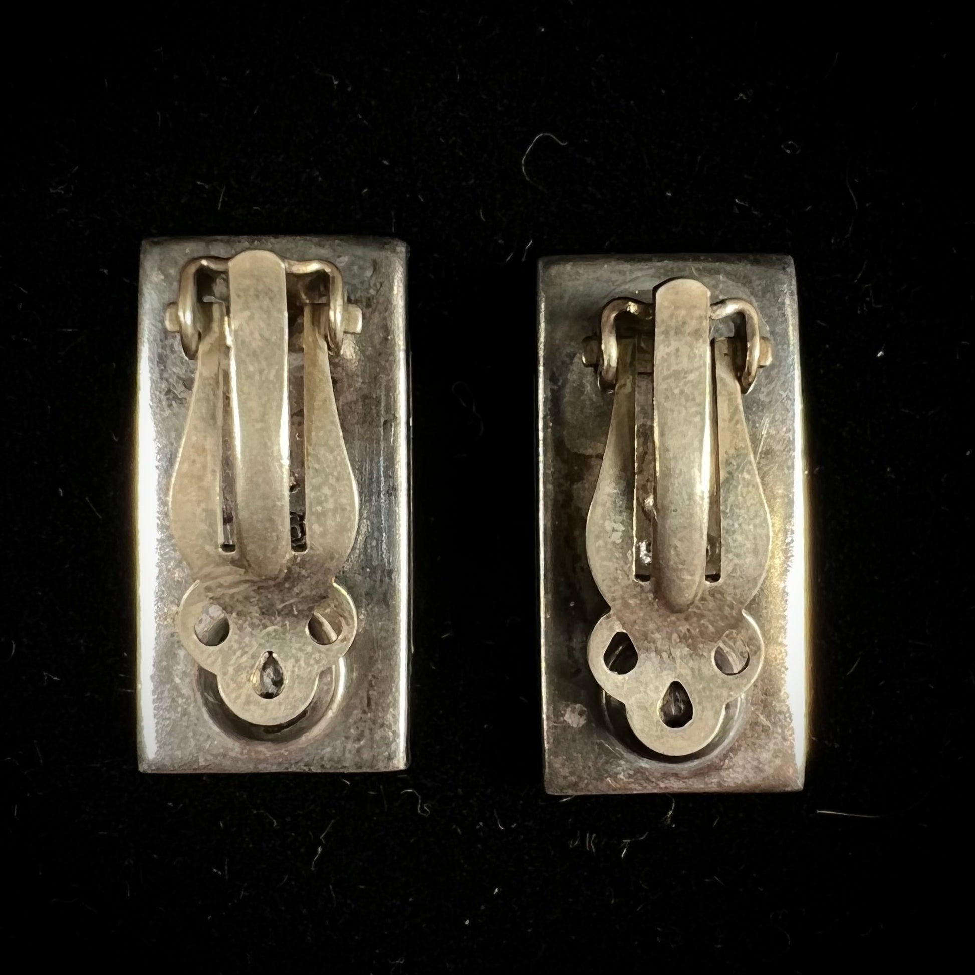 A pair of mother of pearl shell earrings set in sterling silver.