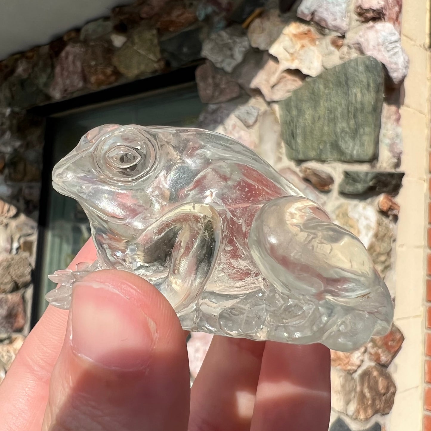 A crystal frog carved from topaz by artist Ronald Stevens.