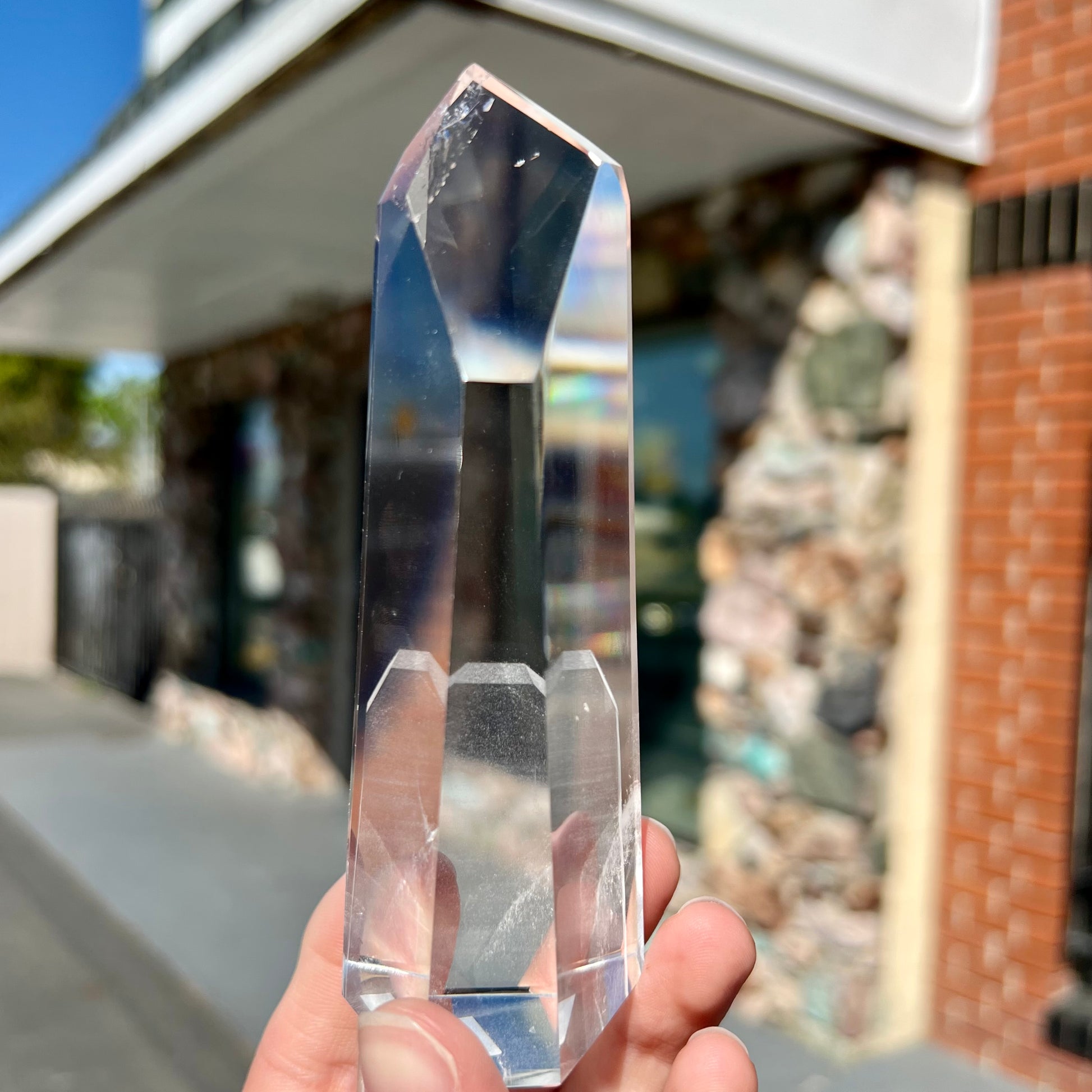 A 5.5 inch clear quartz crystal with a tabular quartz phantom inclusion.