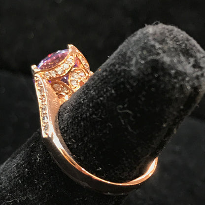 Purple CZ ring with white CZ side stones. Rose gold plated over sterling silver.