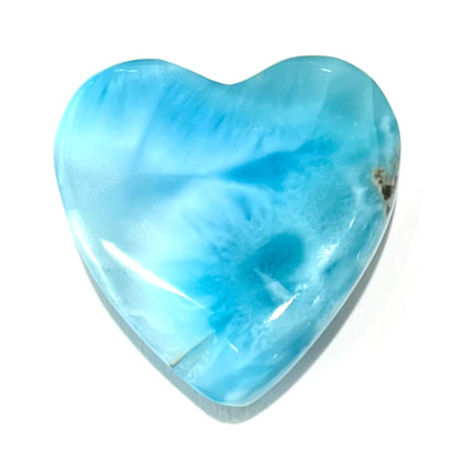 An AAA+ grade larimar stone cut into a heart shaped cabochon.