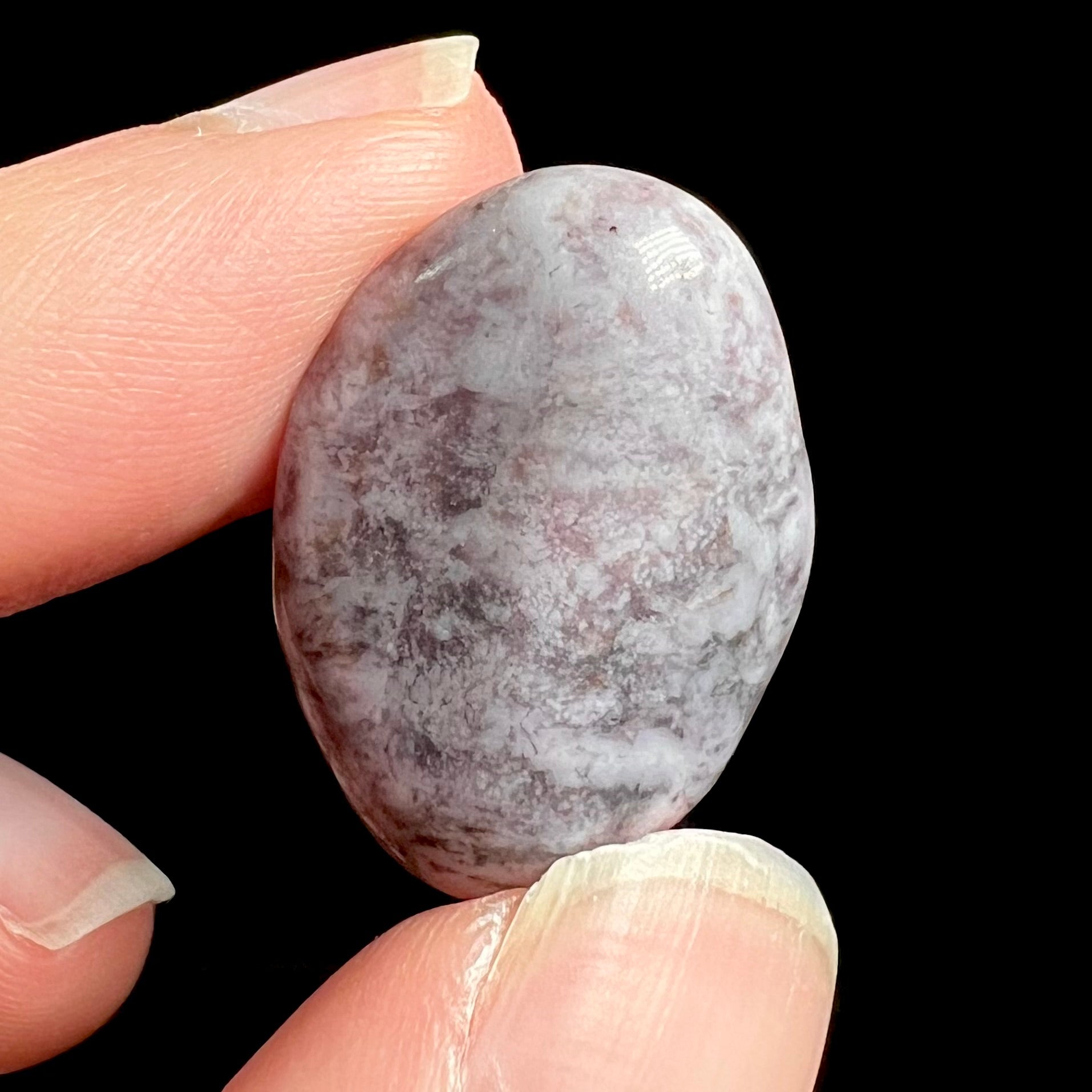 A tumbled purple turkiyenite jade stone from Bursa, Turkey.