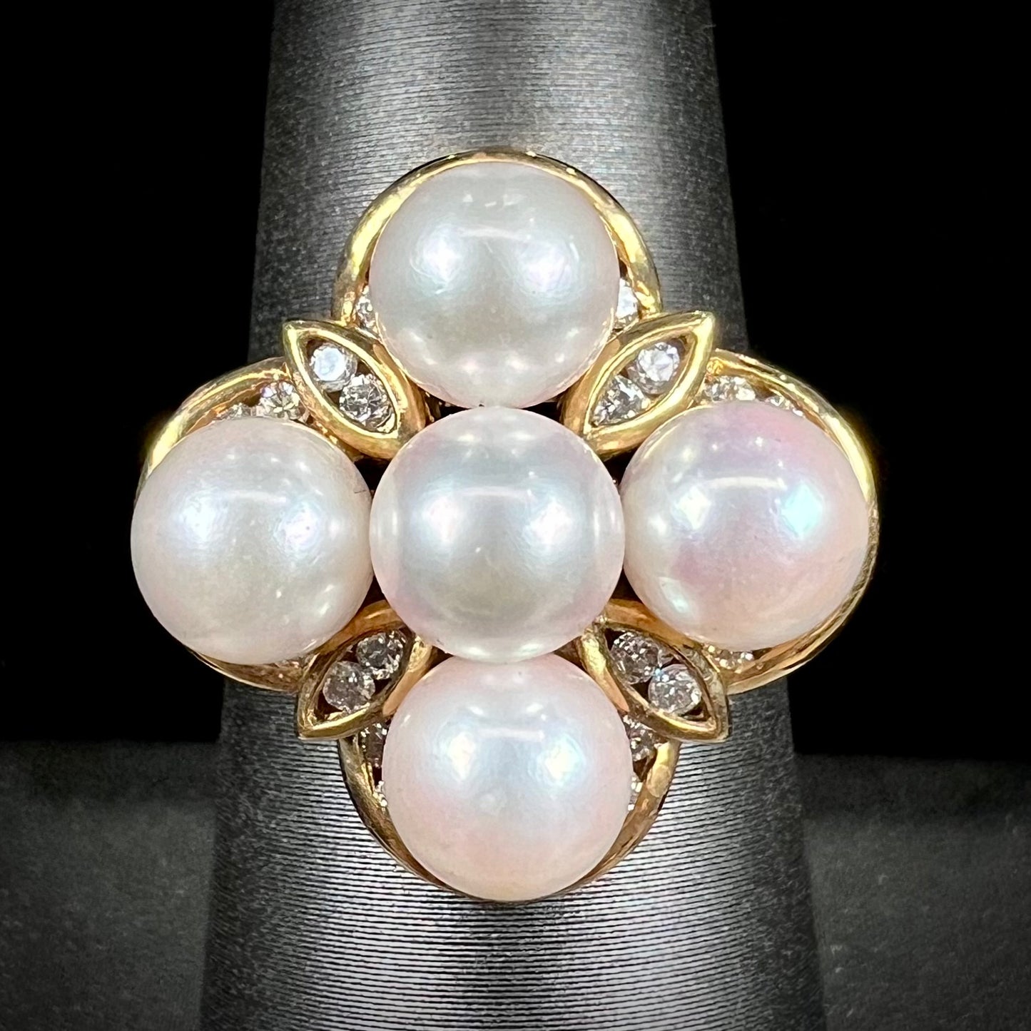 A ladies' vintage 1960's pink Akoya pearl and diamond quatrefoil ring.  The shank of the ring is textured.