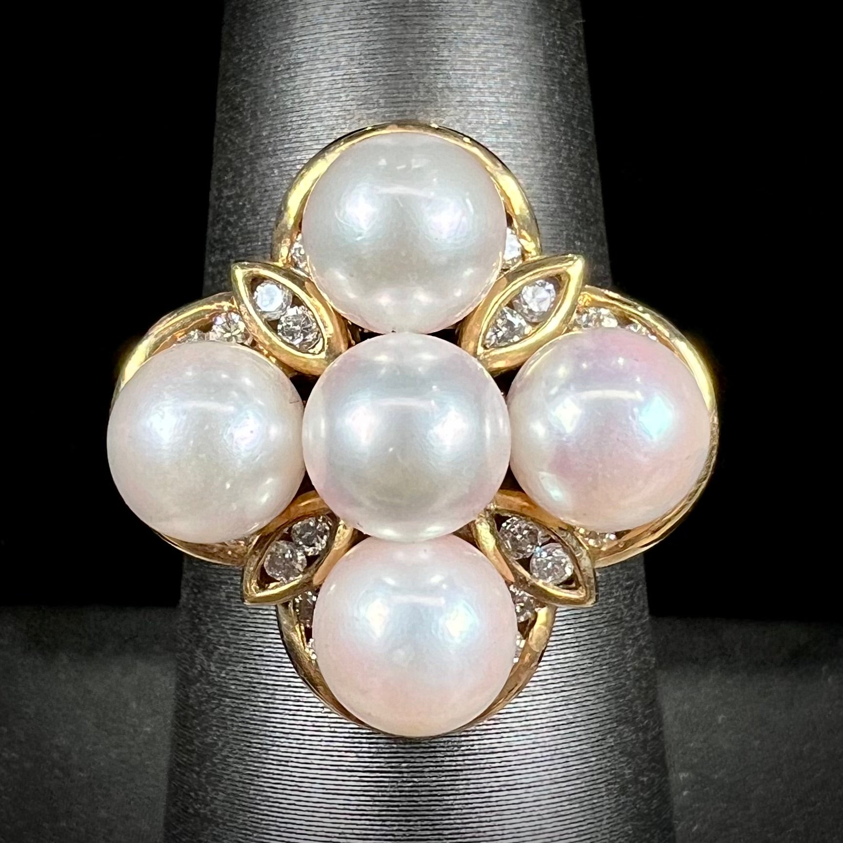 A ladies' vintage 1960's pink Akoya pearl and diamond quatrefoil ring.  The shank of the ring is textured.