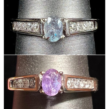 A ladies' white gold and diamond ring set with a 0.26ct alexandrite center stone that changes from green blue to lilac purple.