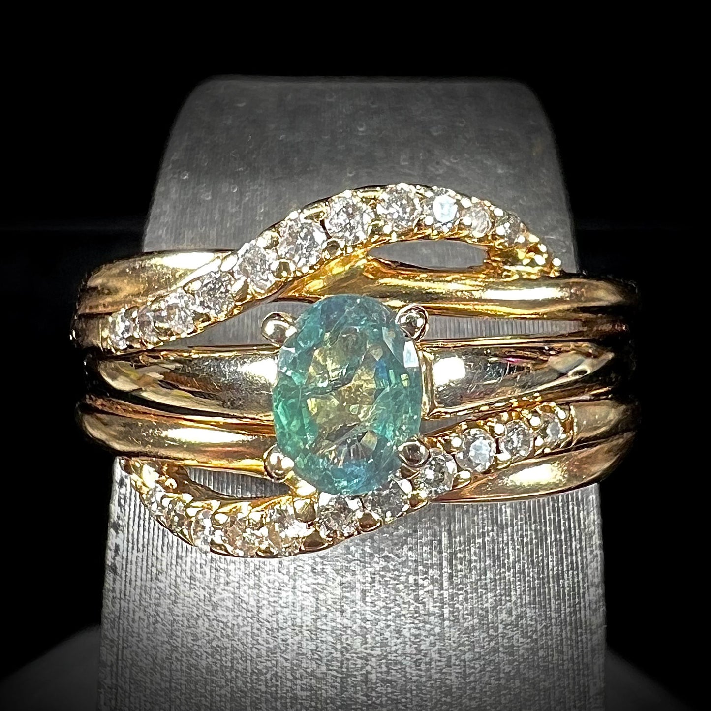 A natural 0.41ct alexandrite ring and ring guard set pave-set with diamonds.