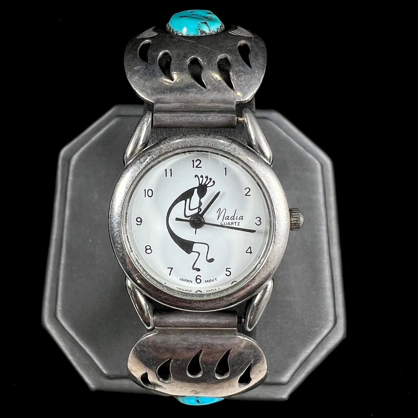 A watch set with two turquoise stones handmade by Navajo artists Arnold and Carleena Goodluck.