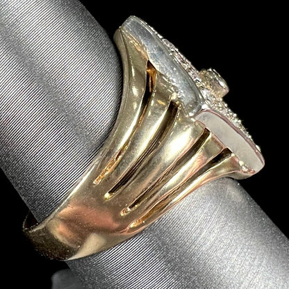 An estate ladies' gold diamond ring.  The shape of the ring resembles an art deco style diamond.