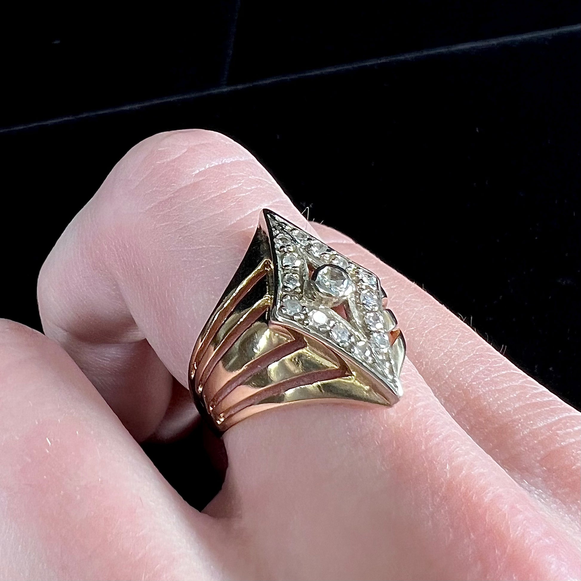 An estate ladies' gold diamond ring.  The shape of the ring resembles an art deco style diamond.